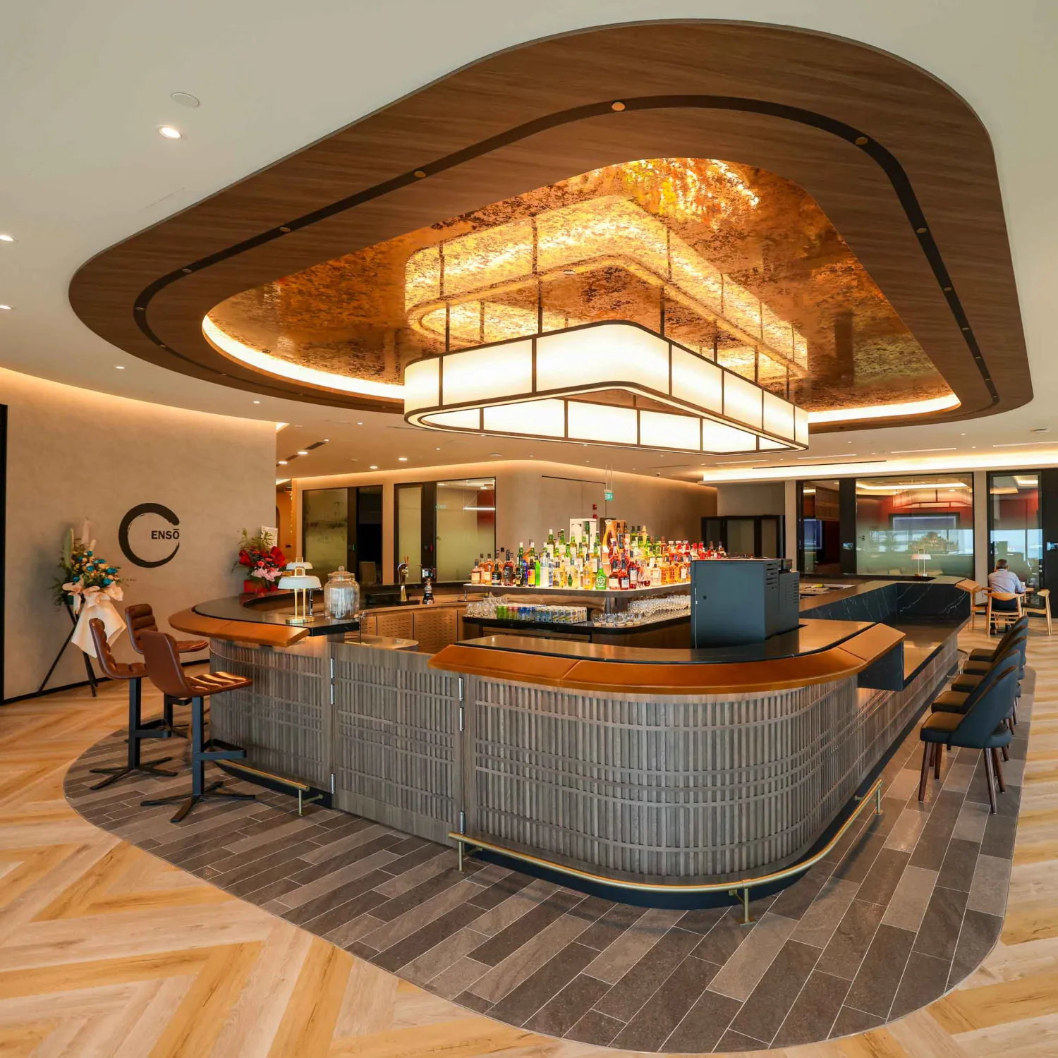 Elegant, curved bar area in a modern office space