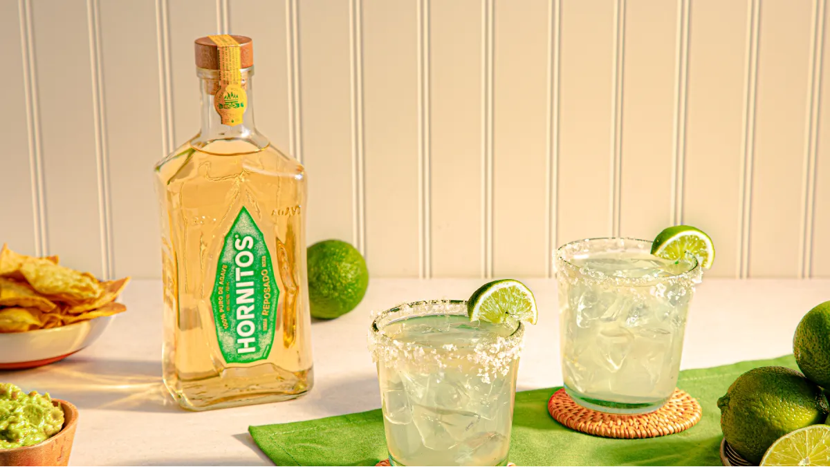 image of Hornitos reposado bottle and cocktail glass filled and placed on table