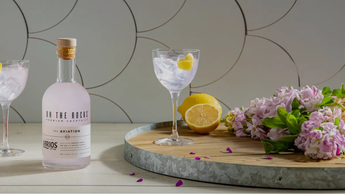 image of Ready to Drink bottle and cocktail glass with lemon placed on table