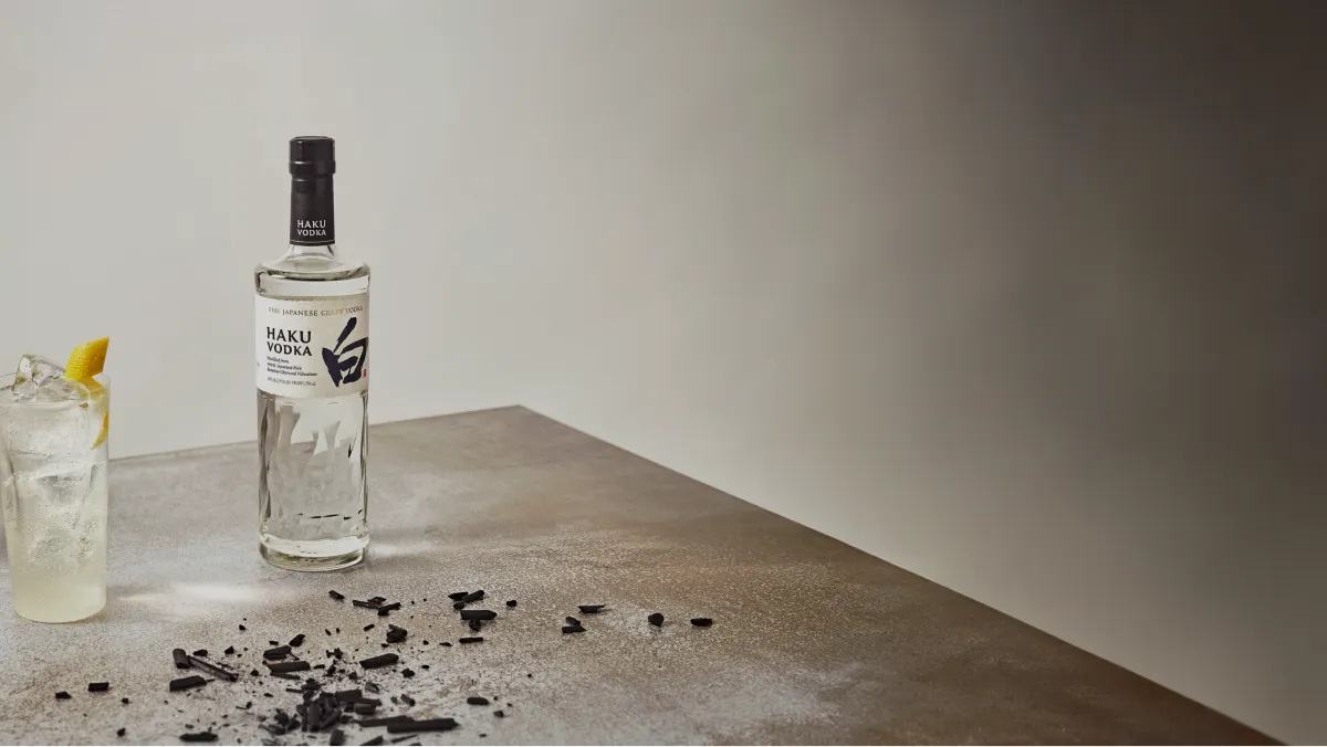 image of Haku Vodka bottle and glass filled placed on table