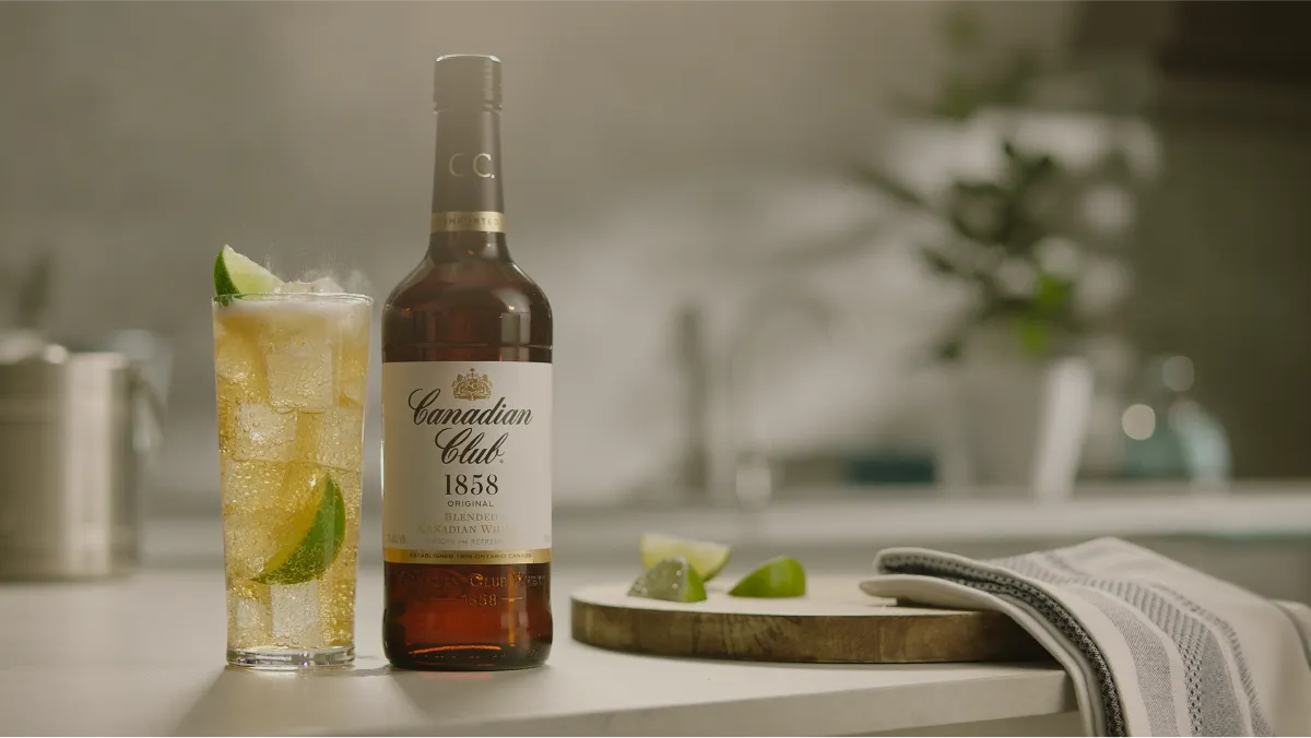 image of Canadian Club bottle and glass filled placed on bottle
