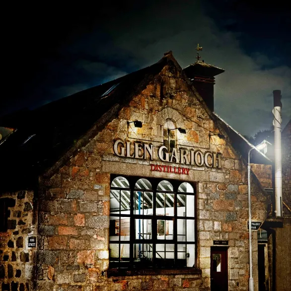 The stone Glen Garioch distillery building at night